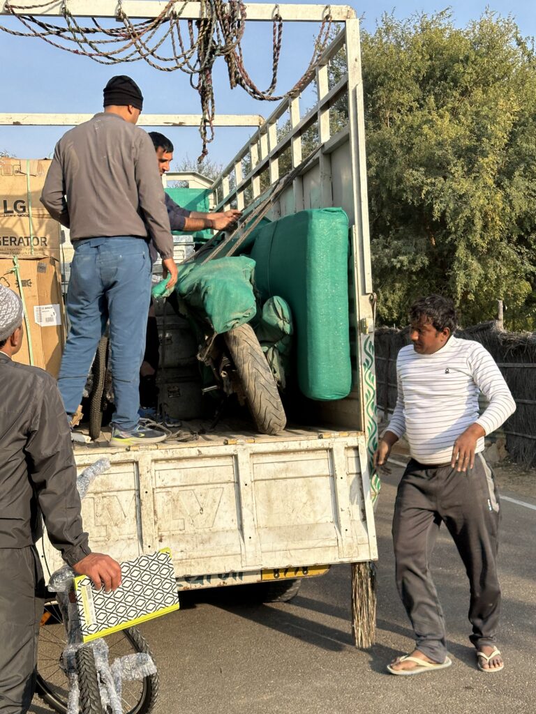 Army child moving homes with packed suitcases and trunks, symbolizing adaptability and constant change.